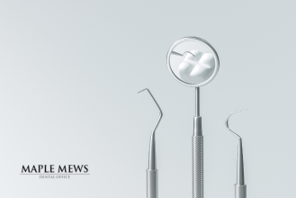 Dentist in Burlington at Maple Mews Dental examining patient for signs of gum disease