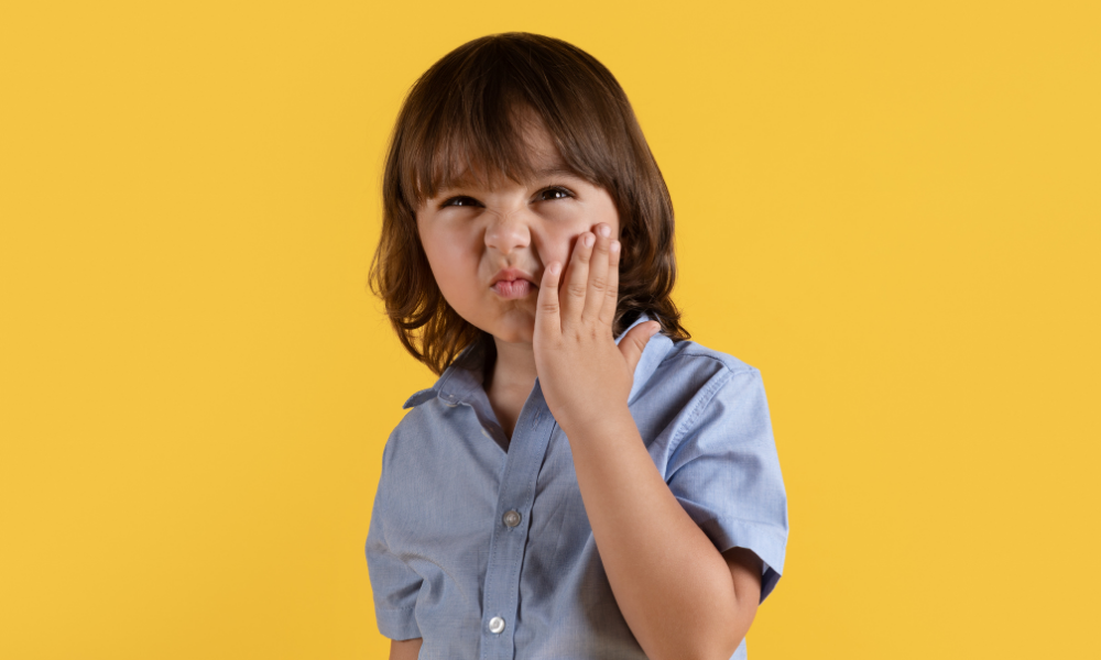ergency dentist at Maple Mews Dental treating a child's dental injury.