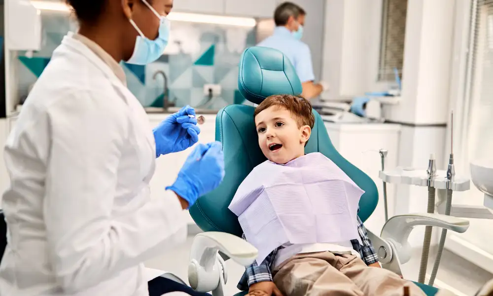 Family dentist at Maple Mews Dental examining multiple generations for gum disease prevention